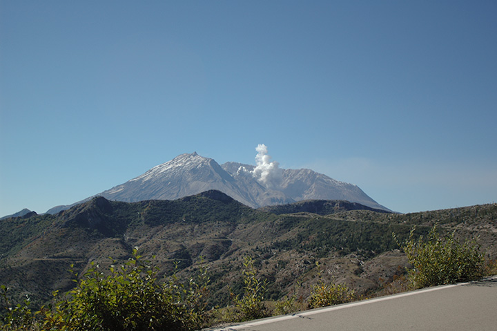 volcano steam plume under clear daytime sky